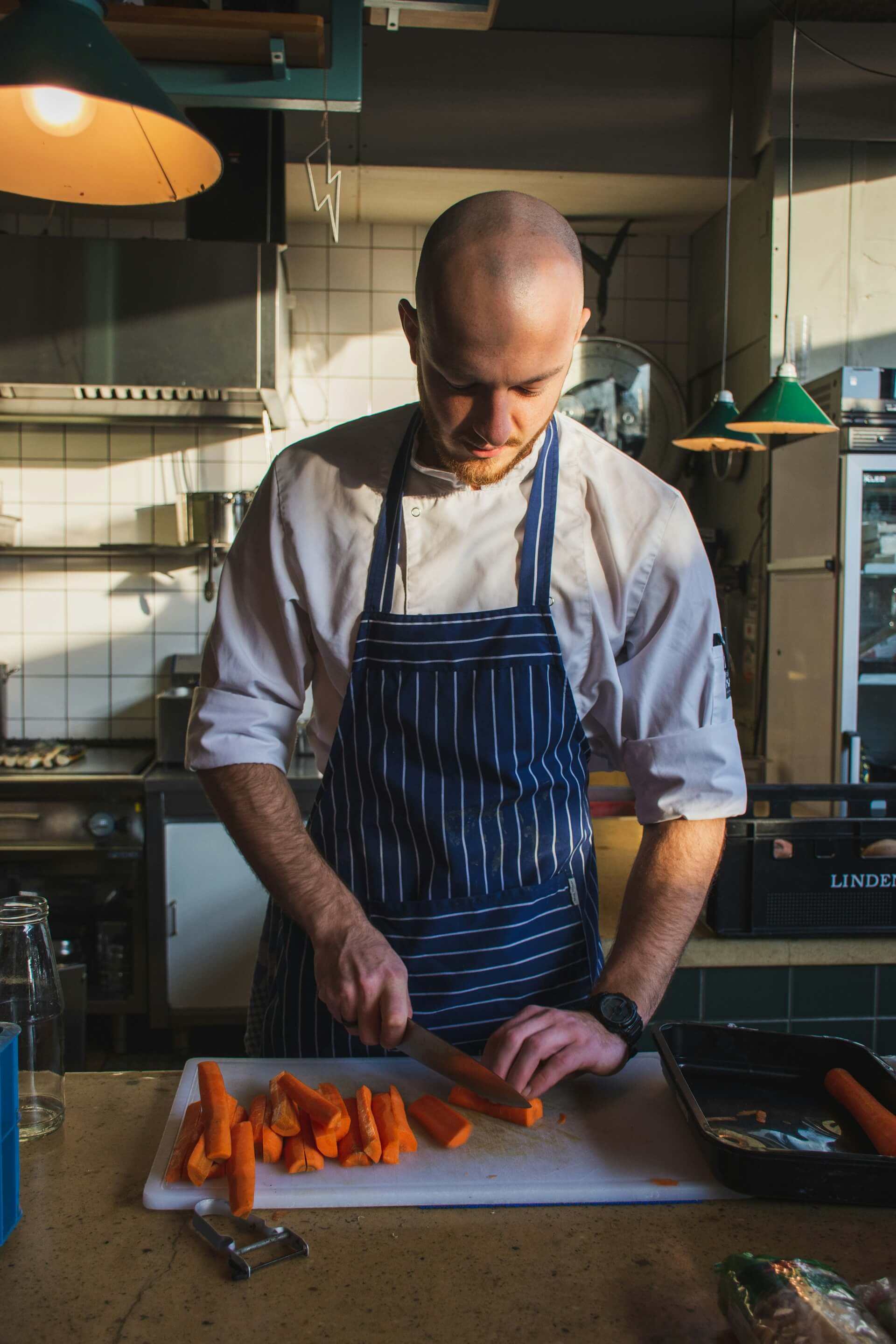 Home Chef Nashville's professional chef carefully preparing a gourmet dish with fresh ingredients