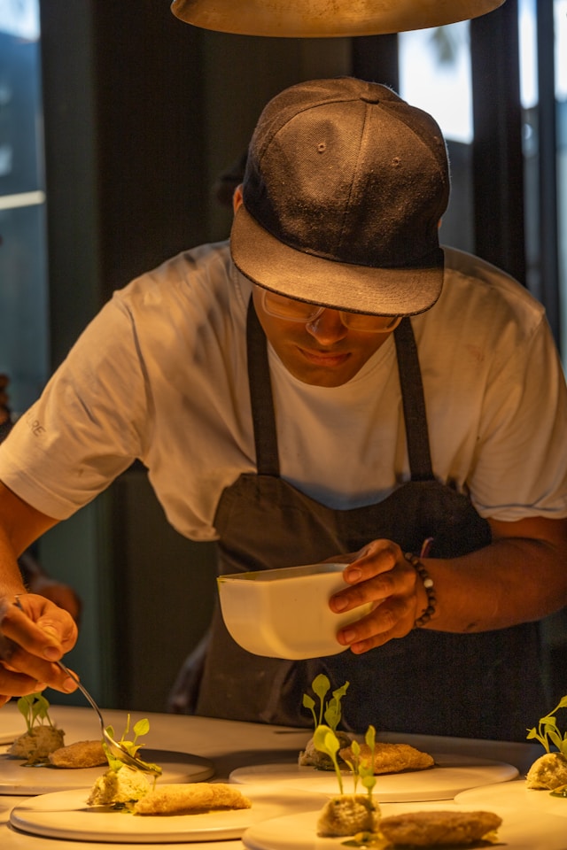 Nashville personal chef plating an elegant multi-course dinner in a client's home